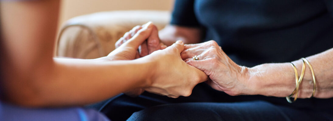 Nurse, senior people and holding hands for support, healthcare service and medical, advice and empathy. Professional doctor, helping and retirement nursing for elderly person in together sign closeup