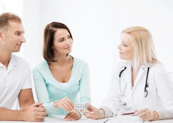 healthcare and medical - doctor giving pills to patients