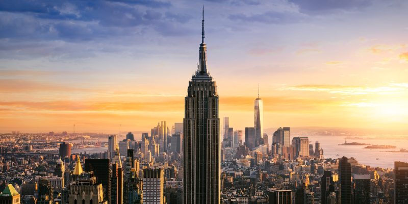 New York City skyline with urban skyscrapers at sunset, USA.